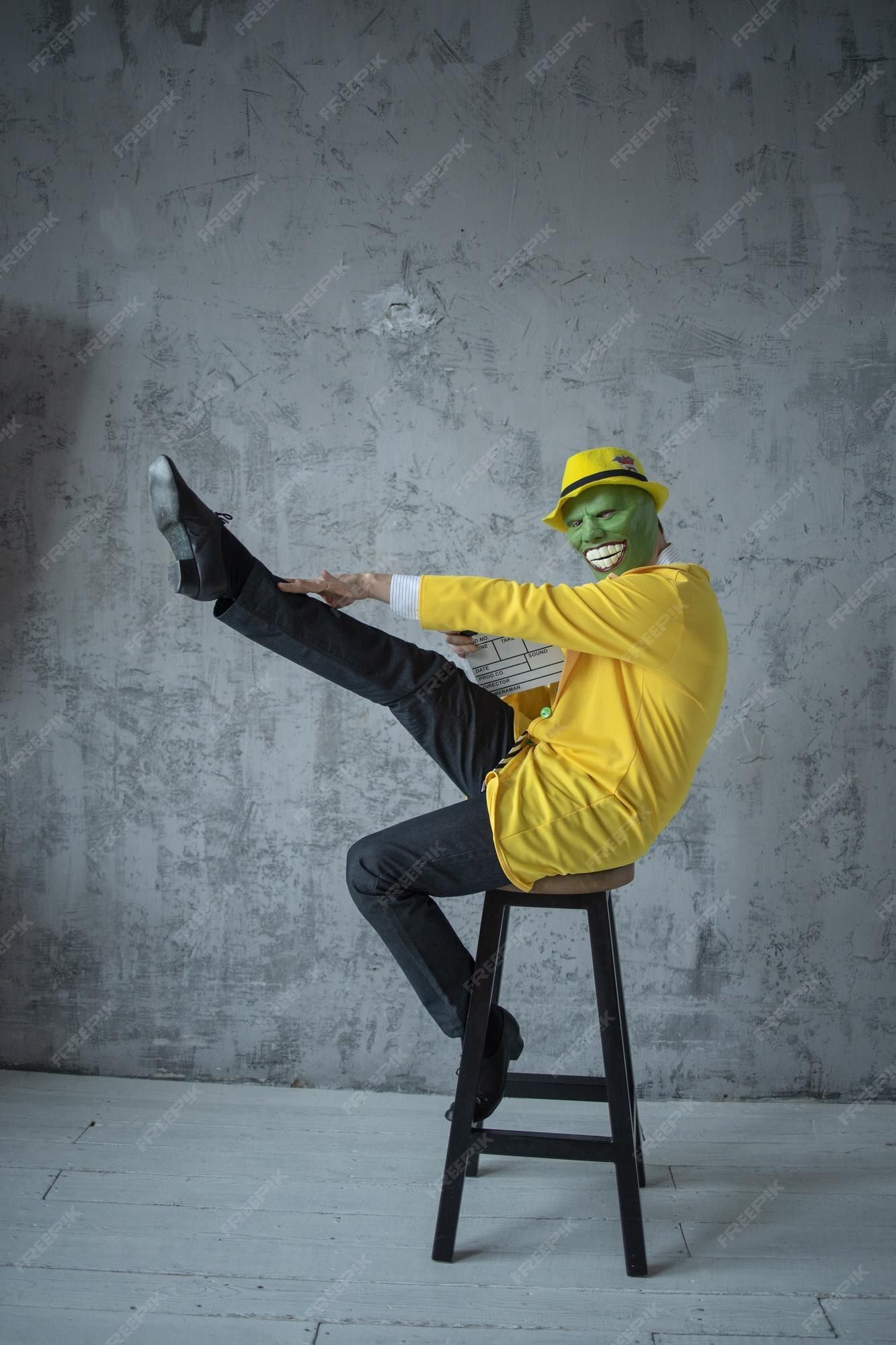 A delivery man stands at a door, holding a box with a T-shirt inside. He knocks, but no one answers. After waiting for a moment, he looks ar...