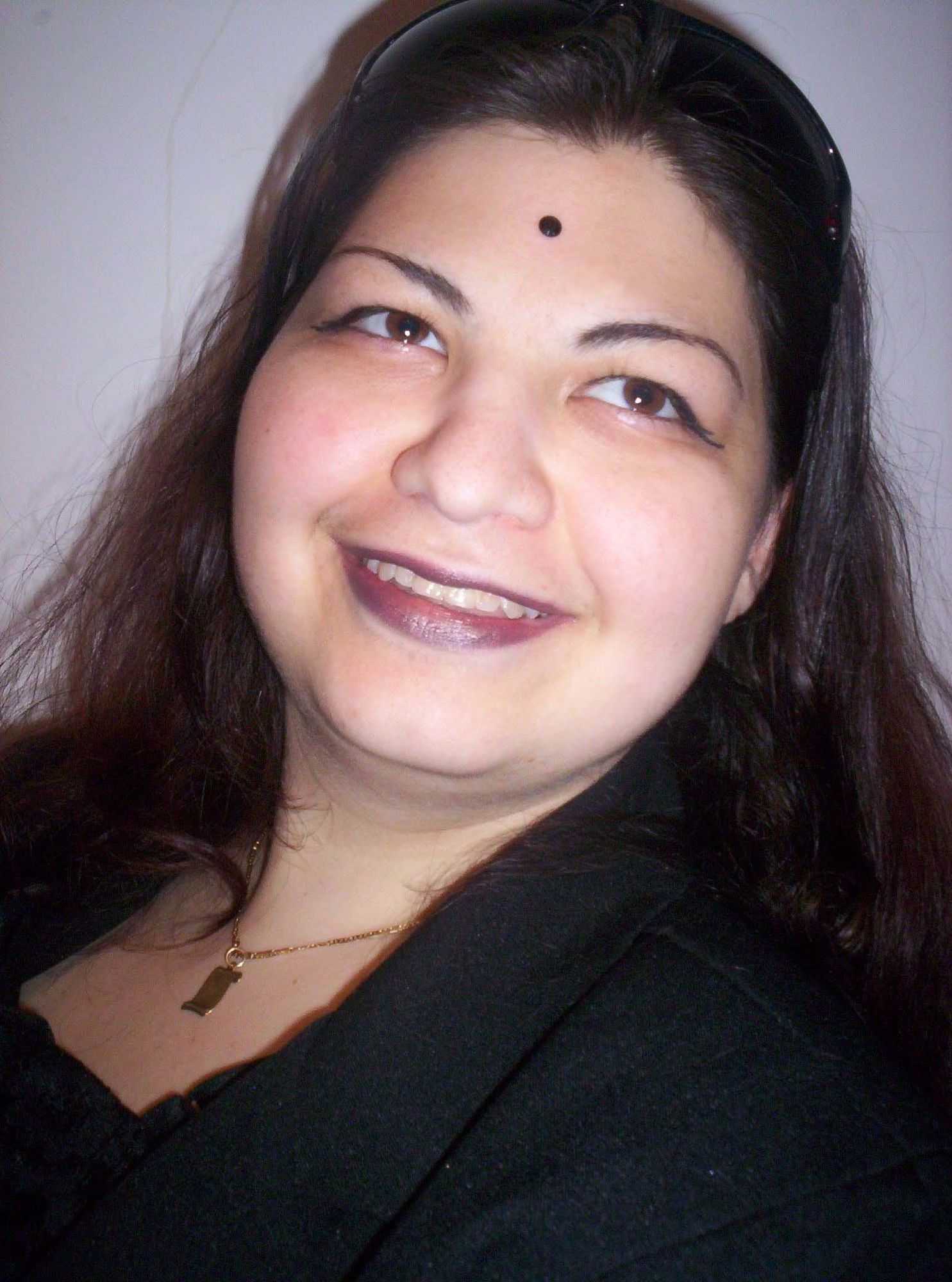 Actual Appearance Mester Ági small chest wearing sunglasses flat square lenses and frame of glasses by the pool red thin lips and black smok...