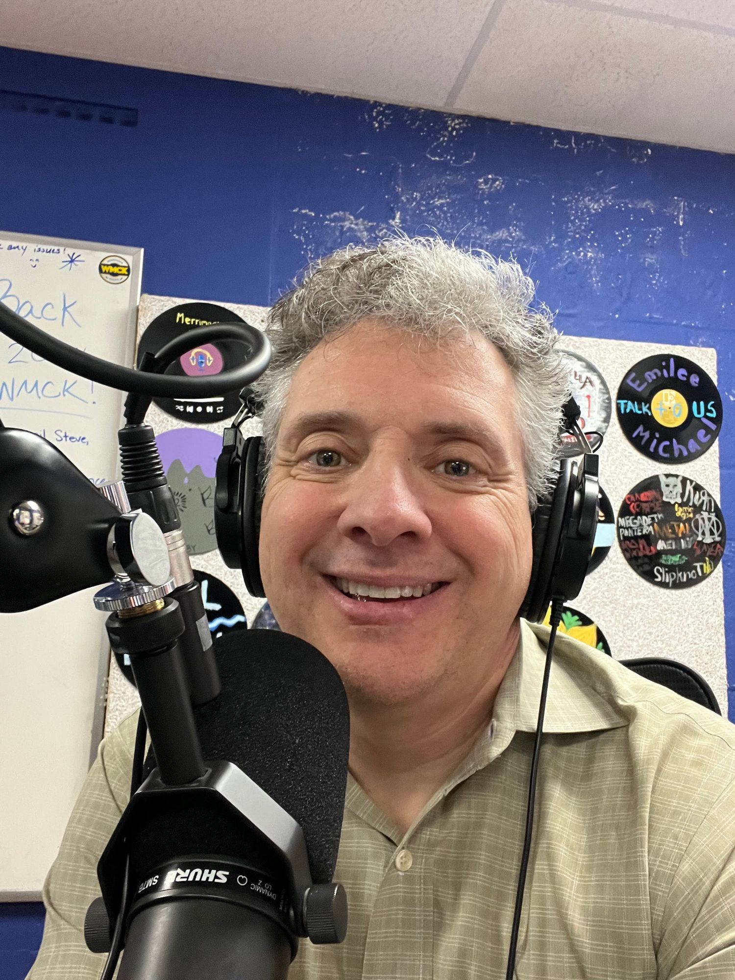 Funky DJ with headphones and a microphone