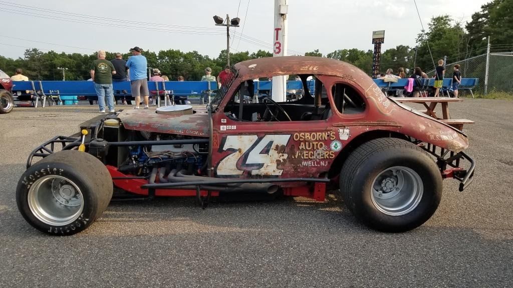 Make this picture a cartoon or illustration. The text to the right of the number 74 should say Osbornes Auto Wreckers