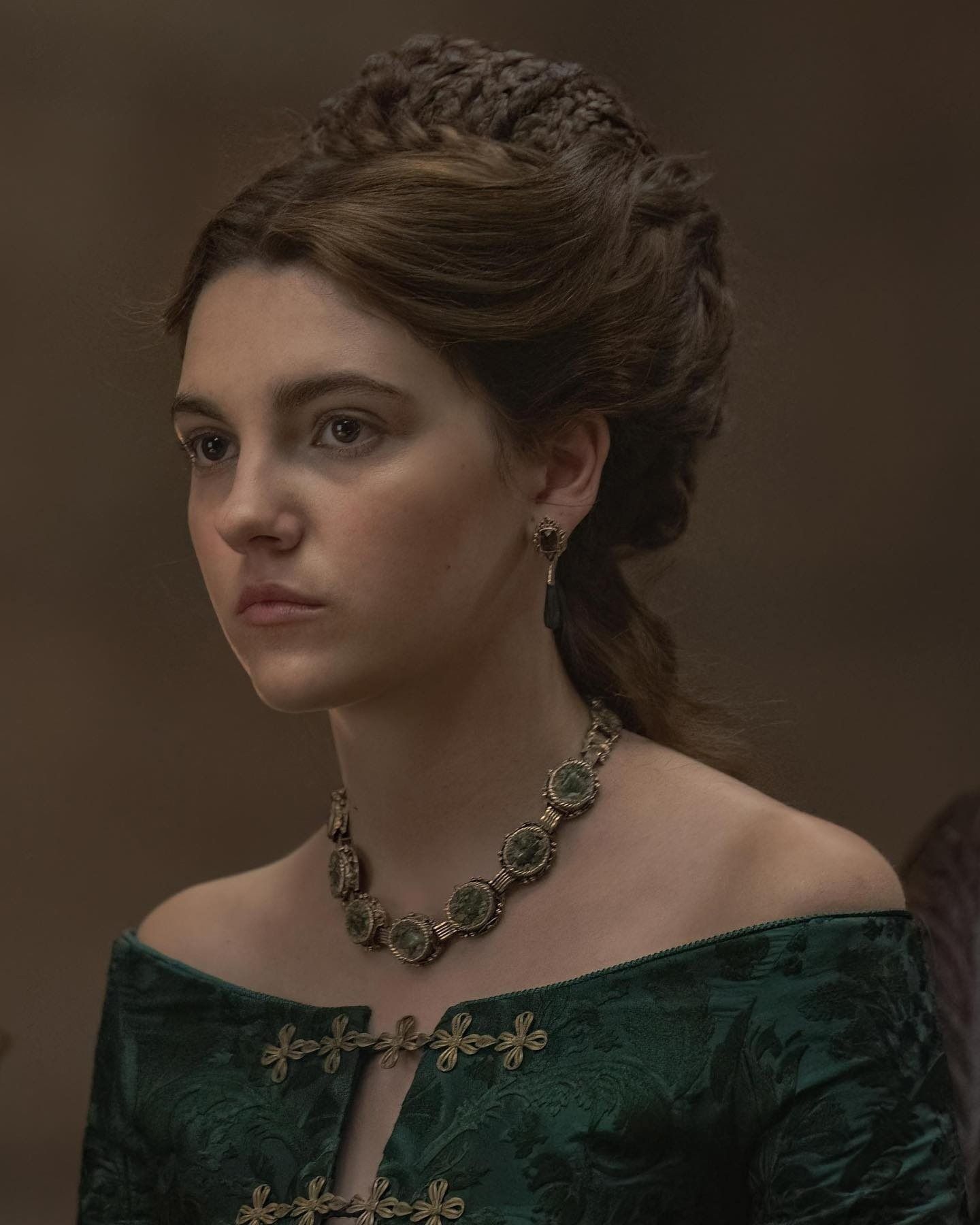 The series house of the dragon. A luxurious medieval room, everything is made in the style of the Middle Ages. A lonely young woman is stand...