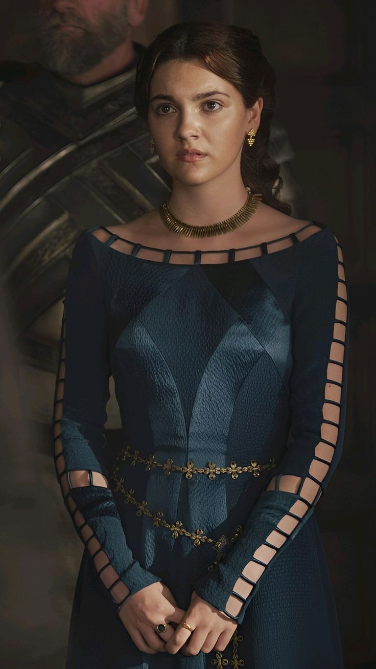 The series house of the dragon. A luxurious medieval hall where everything looks luxurious. There is a beautiful lady here. She has long bla...