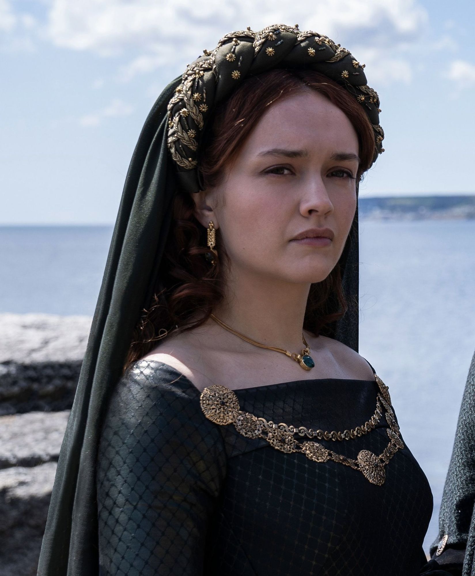 The series house of the dragon. A luxurious medieval room where everything looks exquisite and expensive. There is a young and beautiful que...