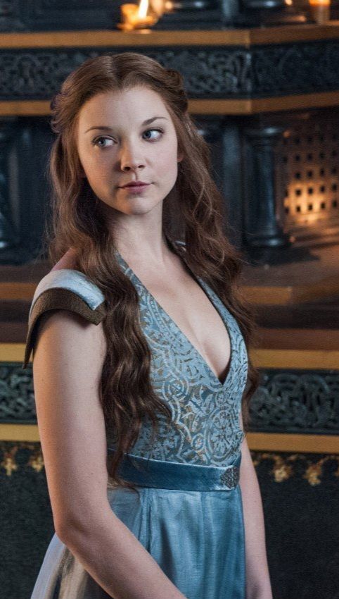 The series house of the dragon. A luxurious medieval room, everything is made in the style of the Middle Ages. A lonely young woman is stand...