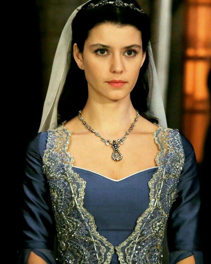 the series house of the dragon. A luxurious medieval room where everything looks beautiful and refined. There is a lonely beautiful lady in...