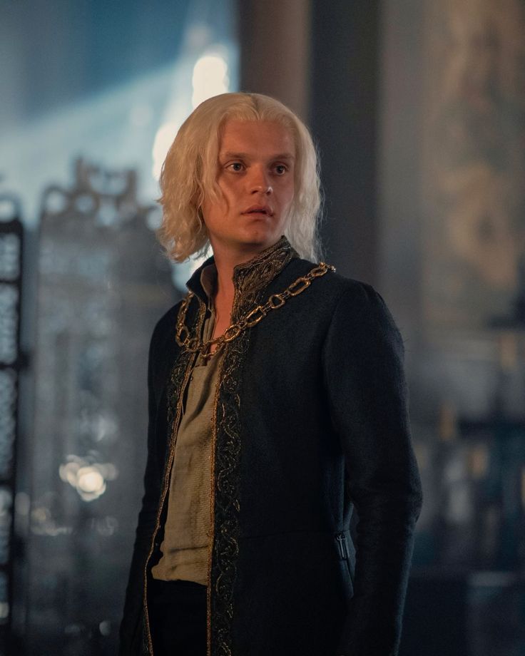 The series house of the dragon. A luxurious medieval room where everything looks elegant and regal. The young king Aegon Targaryen (Tom Glyn...