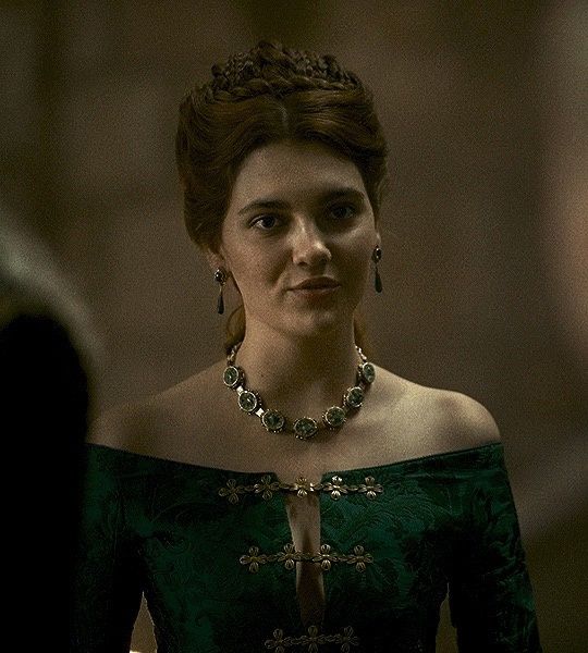 the series house of the dragon. A luxurious medieval room where everything looks beautiful and refined. There is a lonely beautiful lady in...