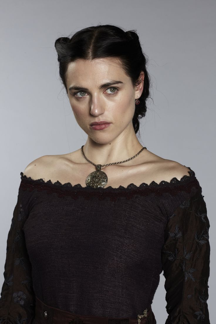 The series house of the dragon. A luxurious medieval throne room where everything looks exquisite and luxurious. There is a young queen in i...